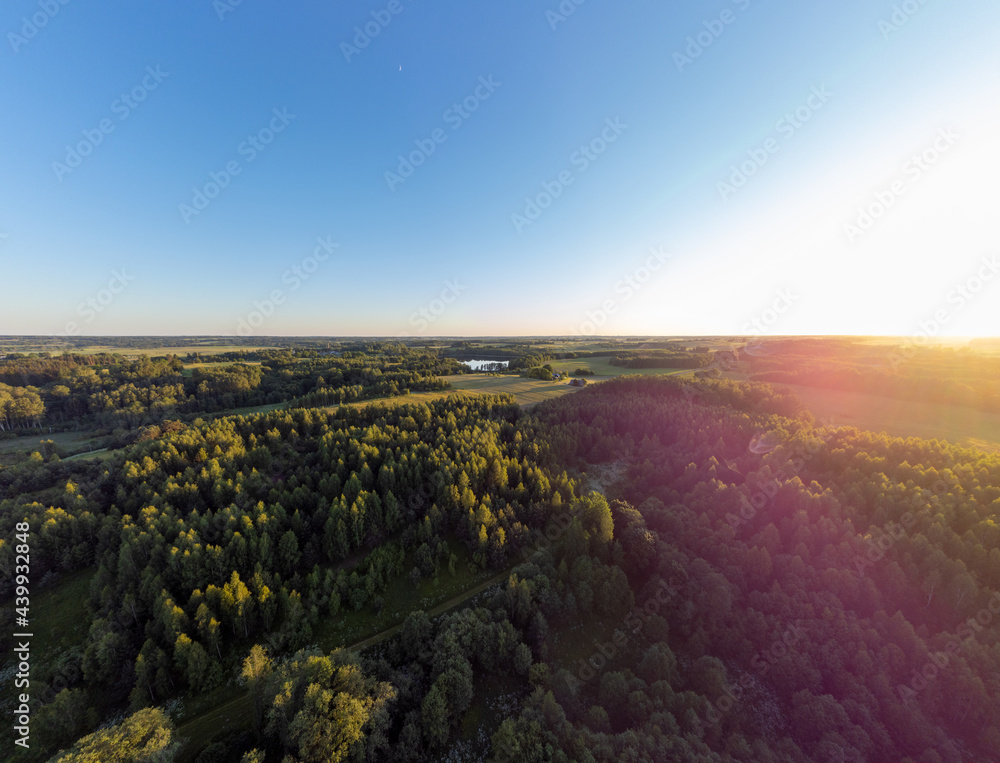 Beautiful aerial panoramic photo of Lithuania country side during summer sunset.