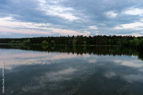 Scenery. Lake in the forest. Reflection of the forest in the water. © Vladyslav B.