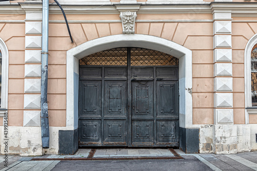 Old cast-iron gate of a residential building  in the Art Nouveau style