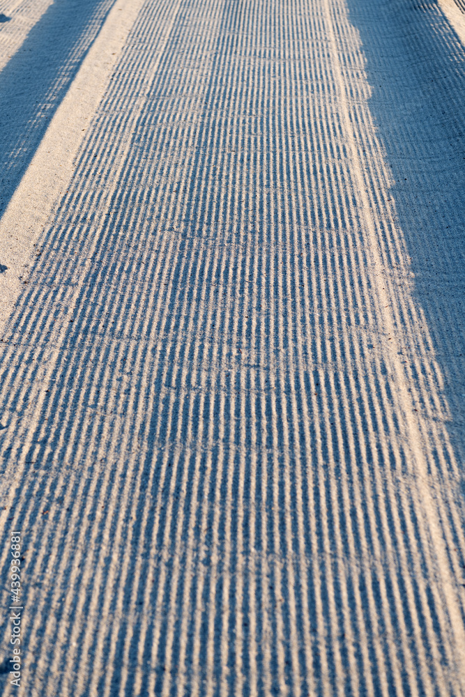 Tire marks on sandy road in Miami, USA, sand surface