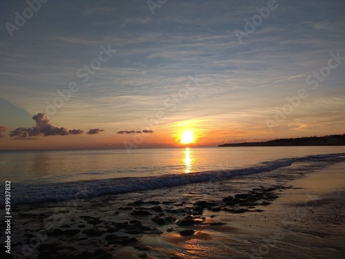 Sunset ocean view. Beautiful sky. Calm ocean water. Sunset sky with clouds.