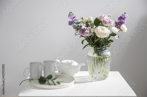 Wallpaper Mural Teapot and two tall tea cups on a tray with a eucalyptus branch on a white table in the interior Torontodigital.ca