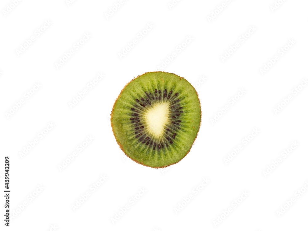 A cross-cut slice of green kiwi isolated on a white background. Exotic, tropical fruit. A cross-cut slice of green kiwi isolated on a white background. Exotic, tropical fruit.