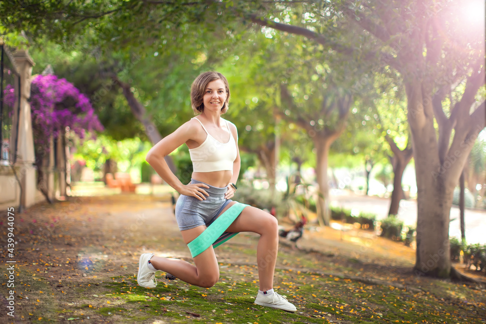 Exercise with fitness rubber bands outdoor. Fitness and healthcare concept Exercise with fitness rubber bands outdoor. Fitness and healthcare concept