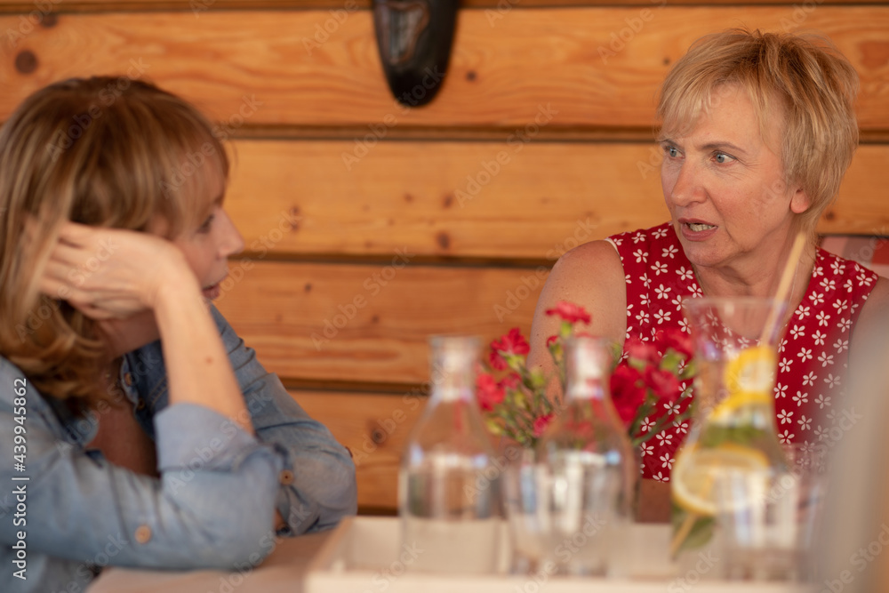 Mature woman talking to friend, health problem, relations support, care. Concept of female friendship Mature woman talking to friend, health problem, relations support, care. Concept of female friendship