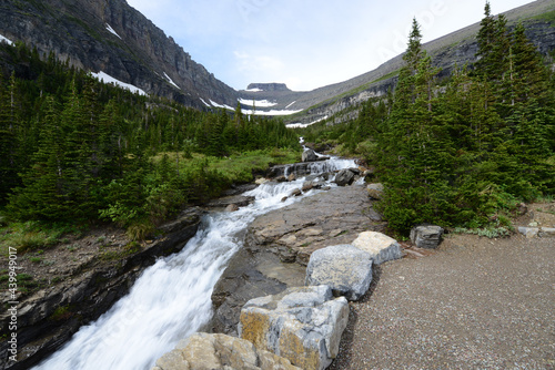 Fotografie, Obraz Waterfall and river at Glacier National Park, just off the Going to the Sun Road