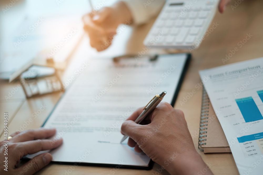 After a discussion in a exclusive room at the corporate , a businessman and his partner sign a contract investment professional paper agreement. After a discussion in a exclusive room at the corporate , a businessman and his partner sign a contract investment professional paper agreement.