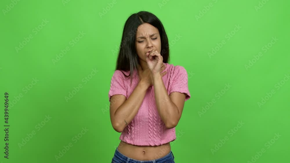 Young woman is suffering with cough and feeling bad over isolated background. Green screen chroma key Young woman is suffering with cough and feeling bad over isolated background. Green screen chroma key