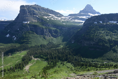 Scenic view of mountains and trees at Glacier National Park in Montana on a sunny day © Jen