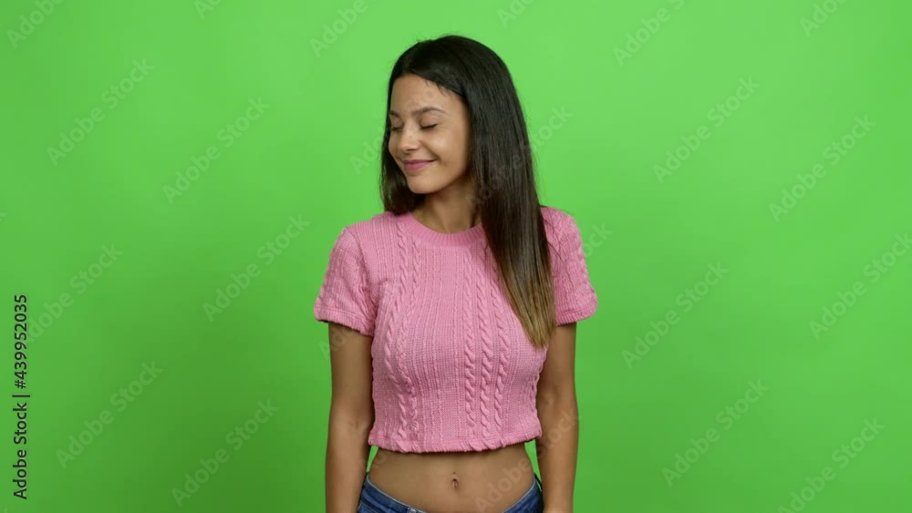 Young woman looking side over isolated background. Green screen chroma key Young woman looking side over isolated background. Green screen chroma key
