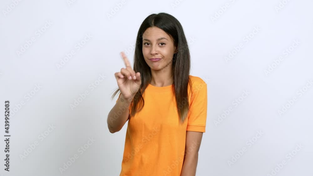Young woman doing NO gesture over isolated background Young woman doing NO gesture over isolated background