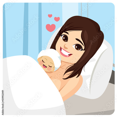 Young beautiful mother doing skin-to-skin contact with newborn baby resting at hospital bed