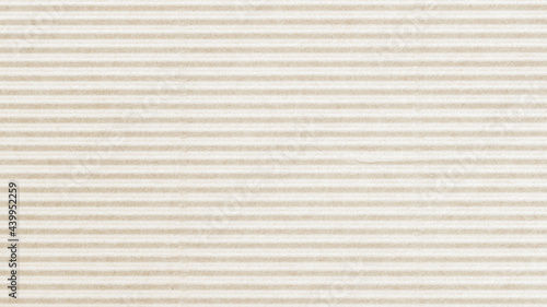 Texture of corrugated striped craft paper, light cream color. Abstract background