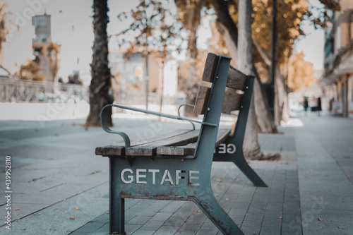 empty bench in the boulervar of a european city