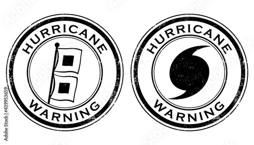 A pair of grunge stamps with hurricane warning designs. Isolated and transparent on white background. 

