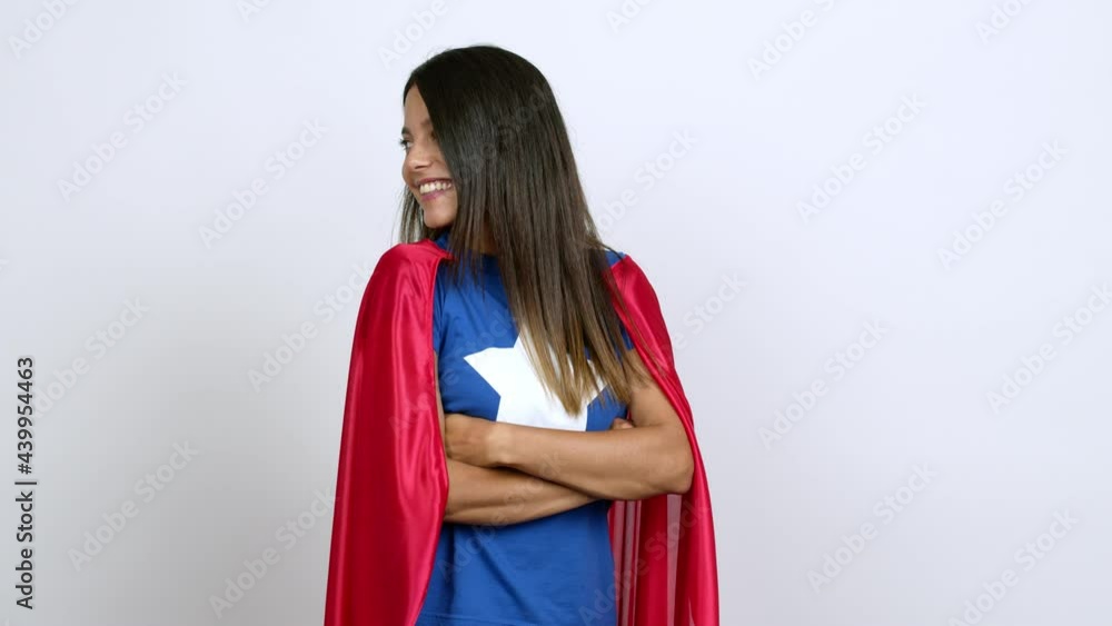 Young woman in superhero costume looking side over isolated background Young woman in superhero costume looking side over isolated background