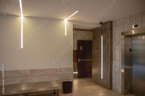 Building lobby with recessed LED light strips on walls and ceilings  nobody