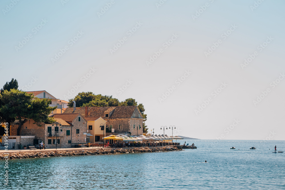 Primosten old town and adriatic beach in Croatia