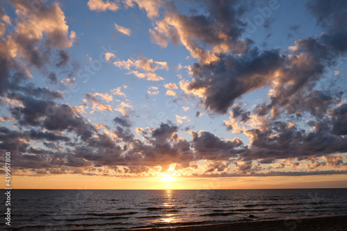 summer sunset on the shore of the Gulf of Finland in the town of Sosnovy Bor photo