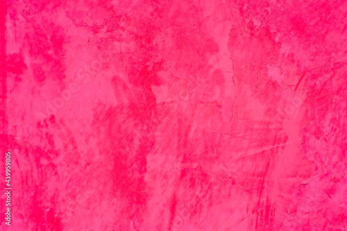 Vivid bright pink painted house wall, exterior or interior decoration, with texture and large empty copy space.