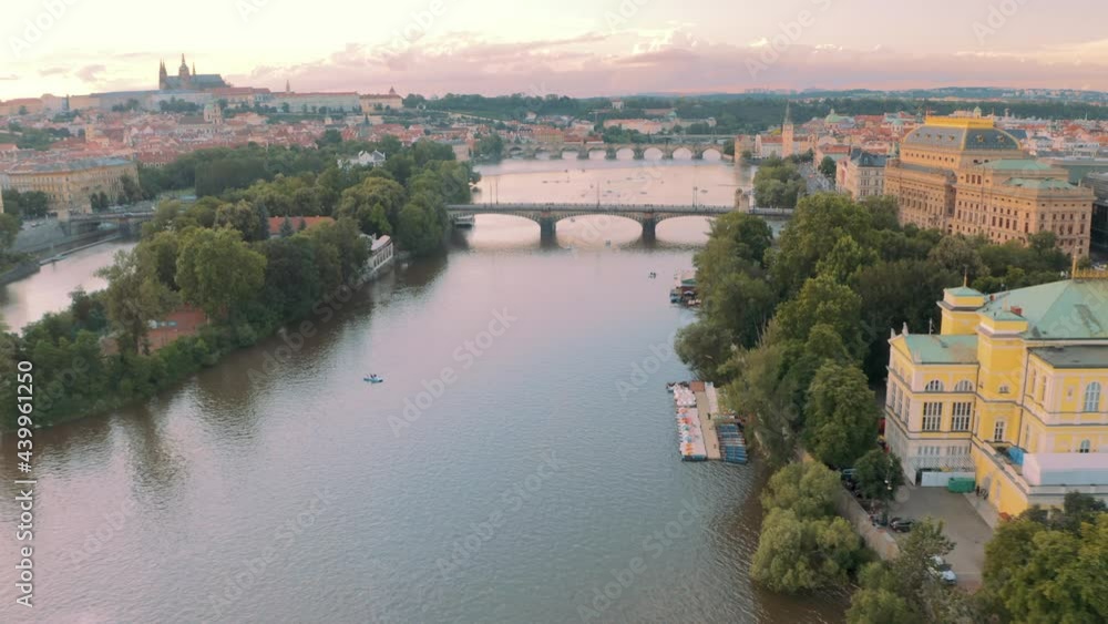 Prague Breathtaking aerial drone shot, flying over river, pink sunset Praha, Czech Republic Prague Breathtaking aerial drone shot, flying over river, pink sunset Praha, Czech Republic