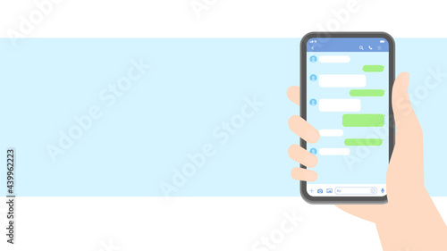 スマートフォン・メッセージアプリイメージ素材：スマホを持つ人の手とトーク画面 - HD16:9比率