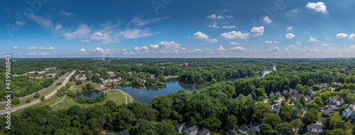Aerial panorama of single family homes and town house neighborhoods around Lake Elkhorn, a manmade lake in Owen Brown village in Columbia Maryland USA