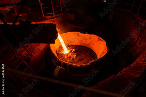 The hot metal is poured into the ladle.