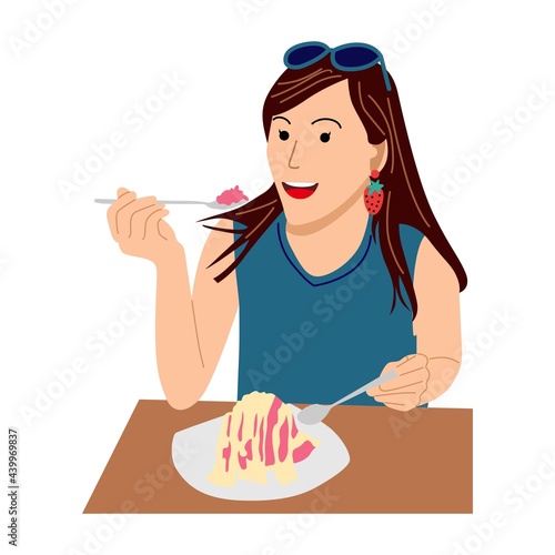 Cute girl sitting at table. Young happy woman dining at home
