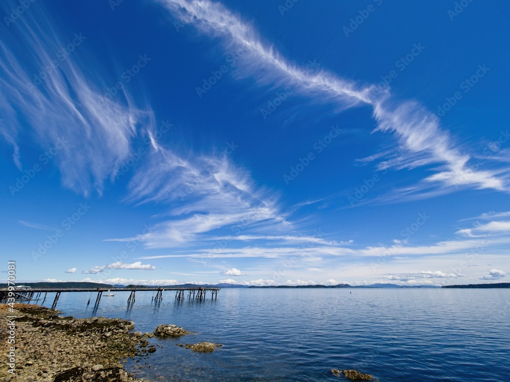 Spectacular clouds over Sidney BC shoreline, seaside boardwalk