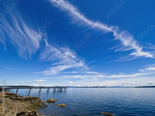 Spectacular clouds over Sidney BC shoreline, seaside boardwalk © pr2is
