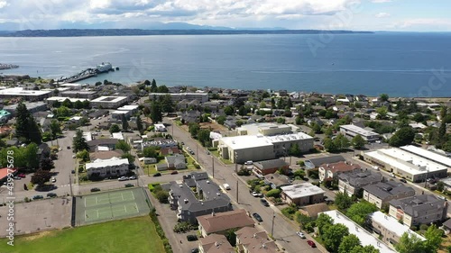 Cinematic 4K drone panning footage of the downtown Edmonds commercial area, Kingston ferry terminal waterfront marina, near Seattle in Western Washington, Pacific Northwest, in Snohomish County photo