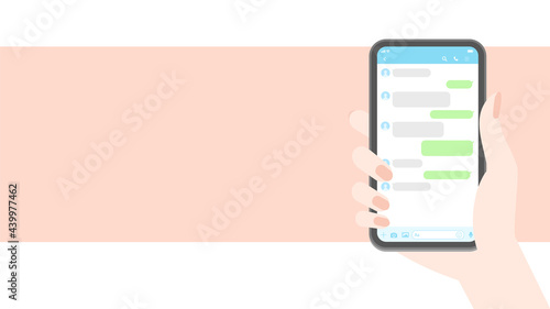 スマートフォン・メッセージアプリイメージ素材：スマホを持つ人の手とトーク画面 - HD16:9比率・ピンク