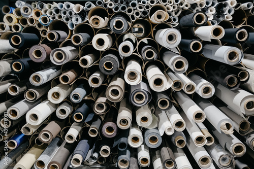 Closeup of rolls of textile and fabric for roller blinds in a factory