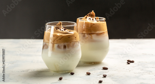 Konstfotografi Dalgona coffee, Korean coffee drink instant coffee or espresso powder whipped with sugar and hot water In a transparent glass