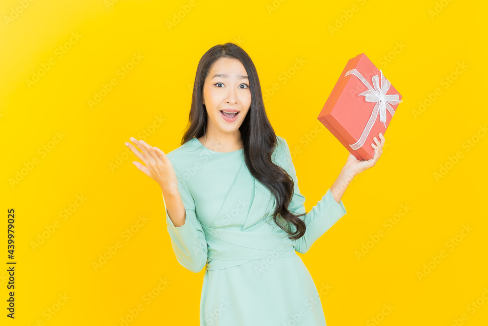 Portrait beautiful young asian woman smile with red gift box Portrait beautiful young asian woman smile with red gift box