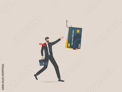 Businessman with credit card on fishing hook