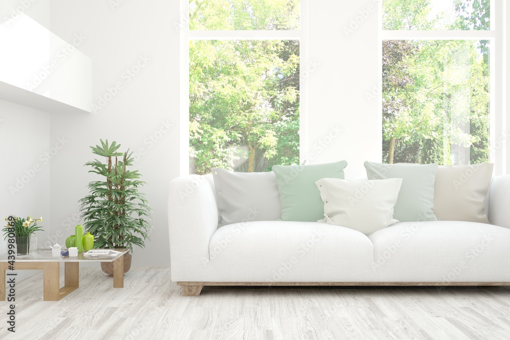 Fototapeta premium White living room with sofa and summer landscape in window. Scandinavian interior design. 3D illustration
