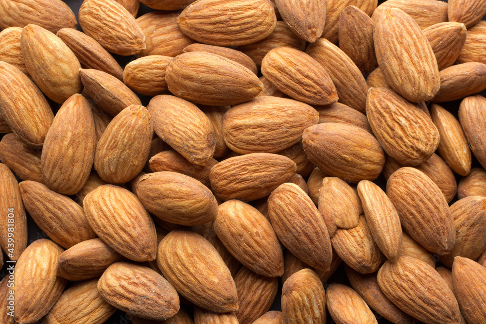 Overhead shot of raw almonds filling the frame. Overhead shot of raw almonds filling the frame.