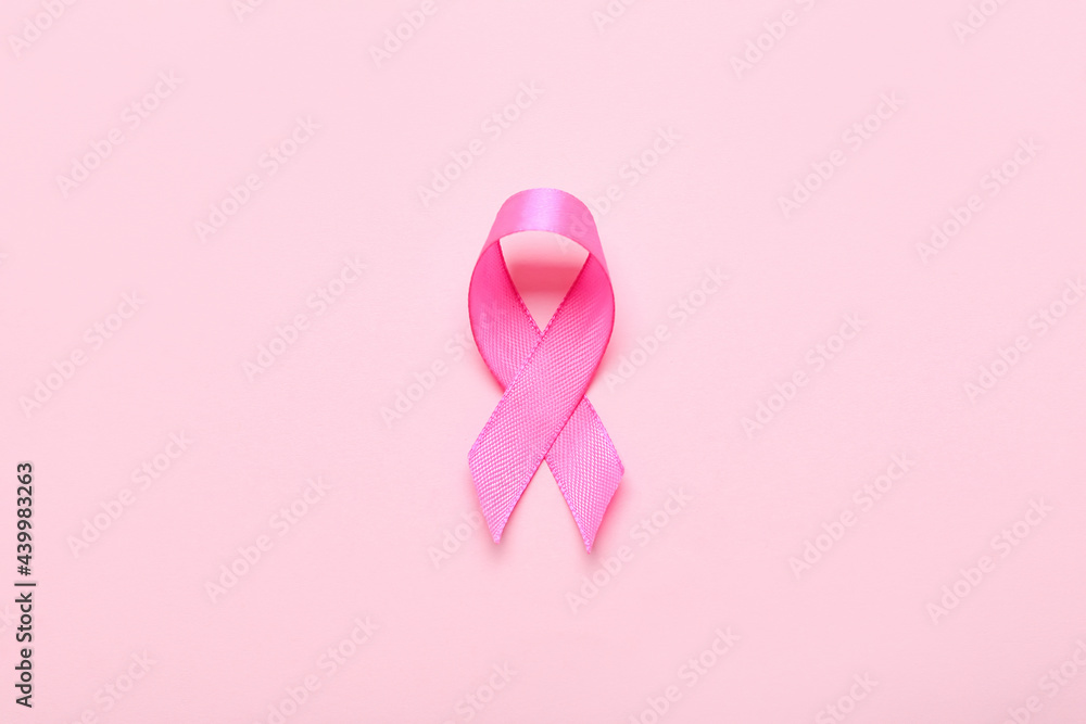 Pink ribbon on color background. Breast cancer awareness concept Pink ribbon on color background. Breast cancer awareness concept