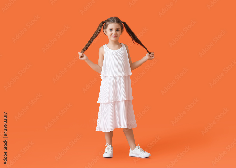 Little girl on color background