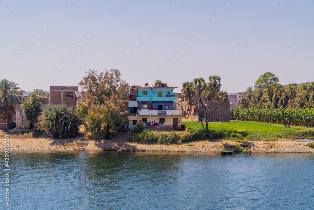 Fototapeta premium Panoramic view of traditional houses on the banks of the Nile River near Edfu, Egypt