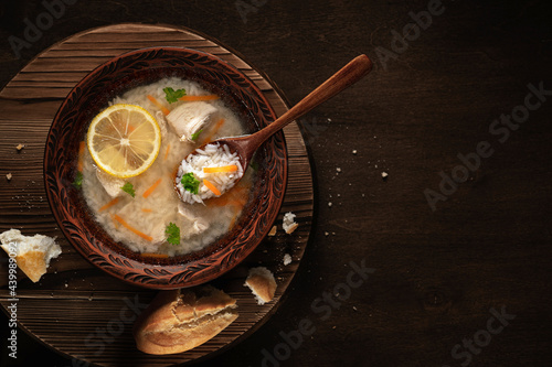 Chicken soup with rice and carrot photo