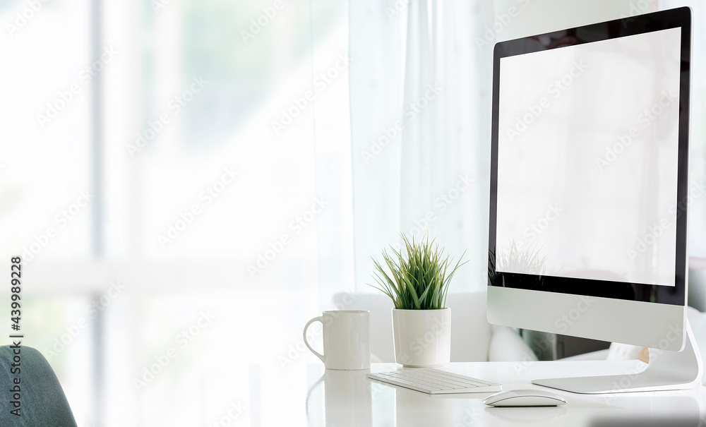 custom made wallpaper toronto digitalMockup bland screen monitor on white table in white room with copy space.