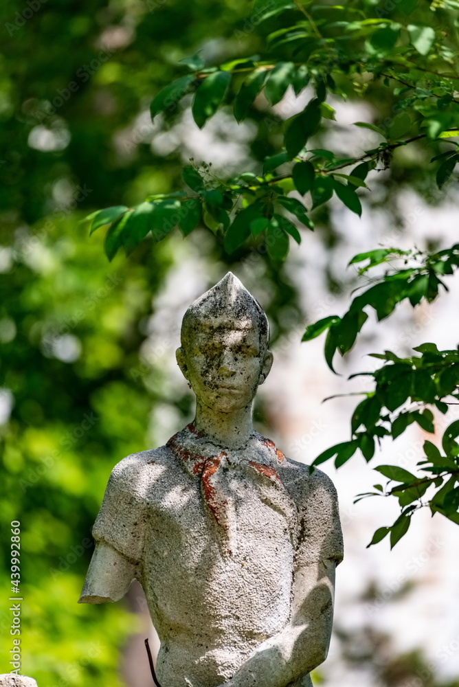 A sculpture destroyed by time, in an abandoned children's camp. Russia A sculpture destroyed by time, in an abandoned children's camp. Russia