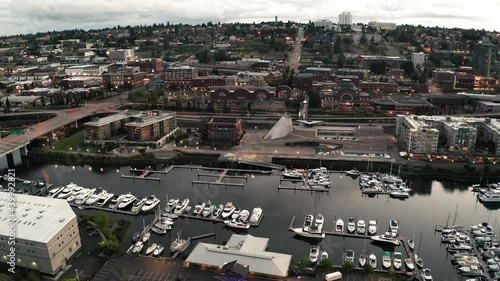 Cinematic 4K evening aerial drone footage of the downtown commercial and waterfront area of Tacoma, a city near Seattle in Western Washington, Pacific Northwest, the economic center of Pierce County photo