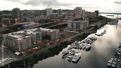 Cinematic 4K aerial drone sunset footage of the downtown commercial and waterfront area of Tacoma, a city near Seattle in Western Washington, Pacific Northwest, the economic center of Pierce County photo