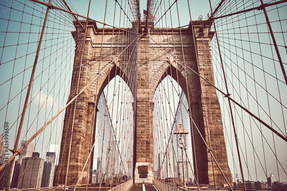 Fototapeta premium Brooklyn Bridge, color toned picture, New York City, USA.