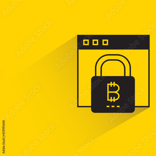 bitcoin key on web with shadow on yellow background