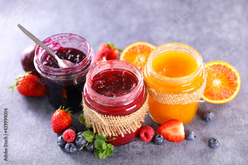 assortment of jams and fresh fruits photo